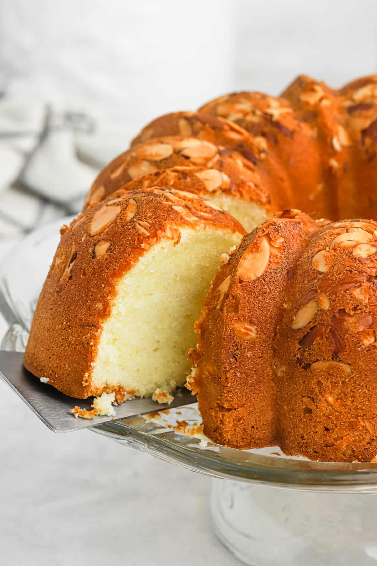 Taking a slice out of the pound cake.
