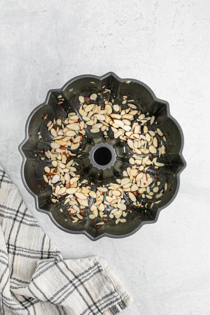 Sliced almonds in the bottom of the bundt cake pan.