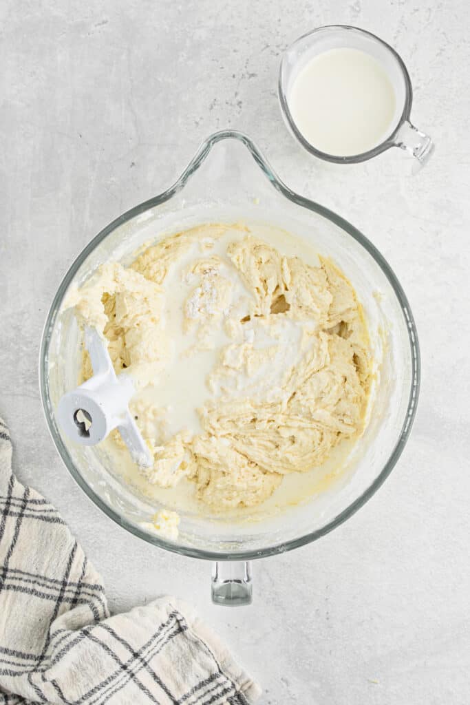 Cake batter mixed in the bowl of a stand mixer.