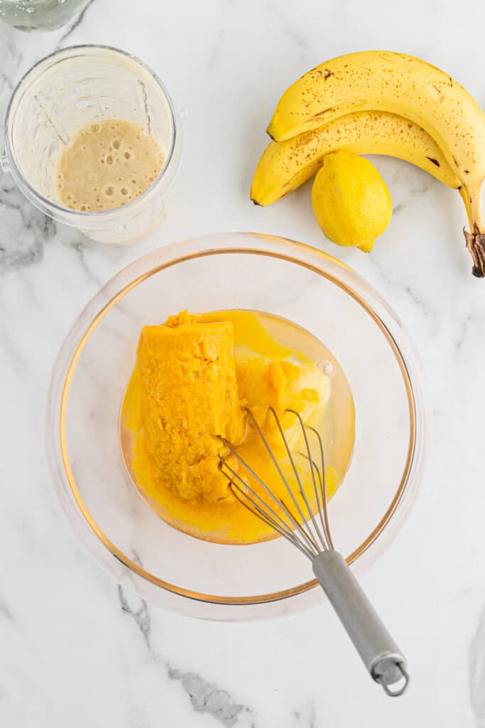 juice concentrate in a bowl with a whisk.