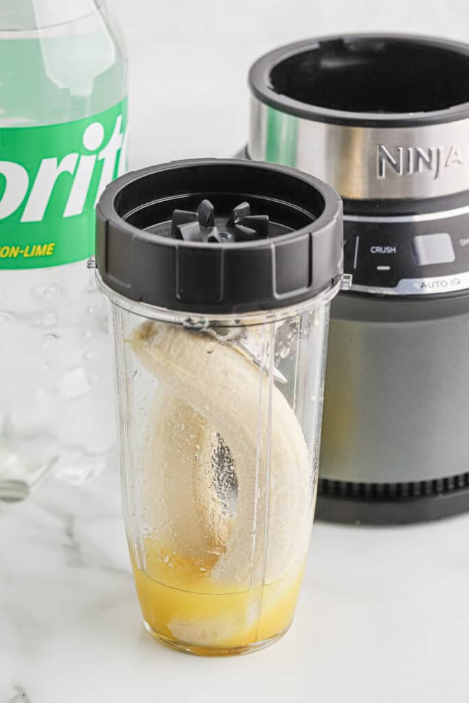 Bananas in a blender cup.