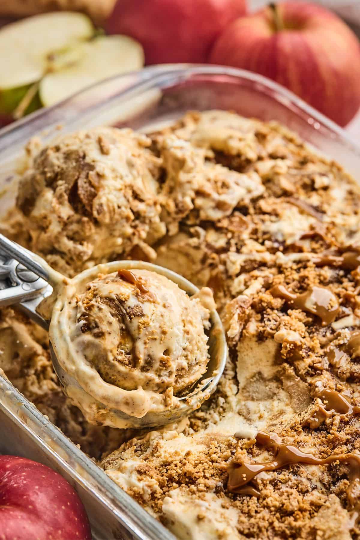 Apple pie ice cream being scooped with an ice cream scoop