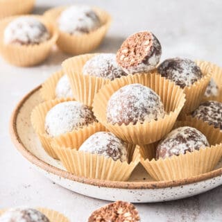 Old fashioned bourbon balls on a white plate ready to enjoy