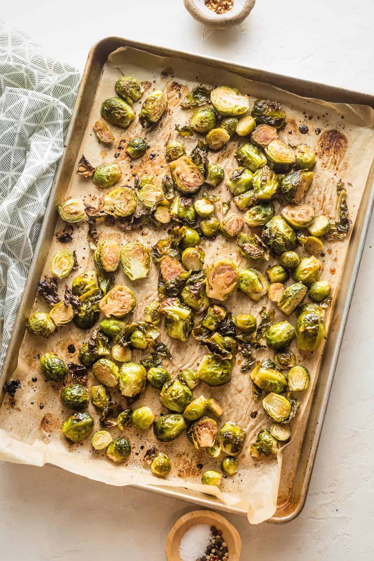 freshly roasted brussels sprouts on a baking sheet