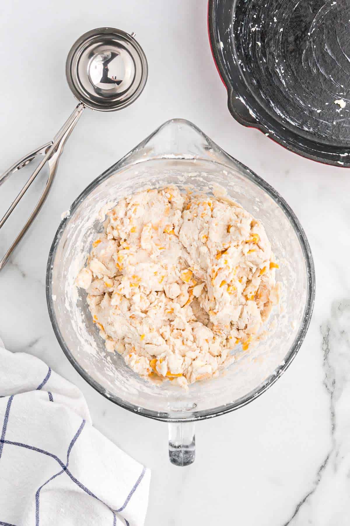 Mixed garlic cheddar biscuit dough in the bowl.