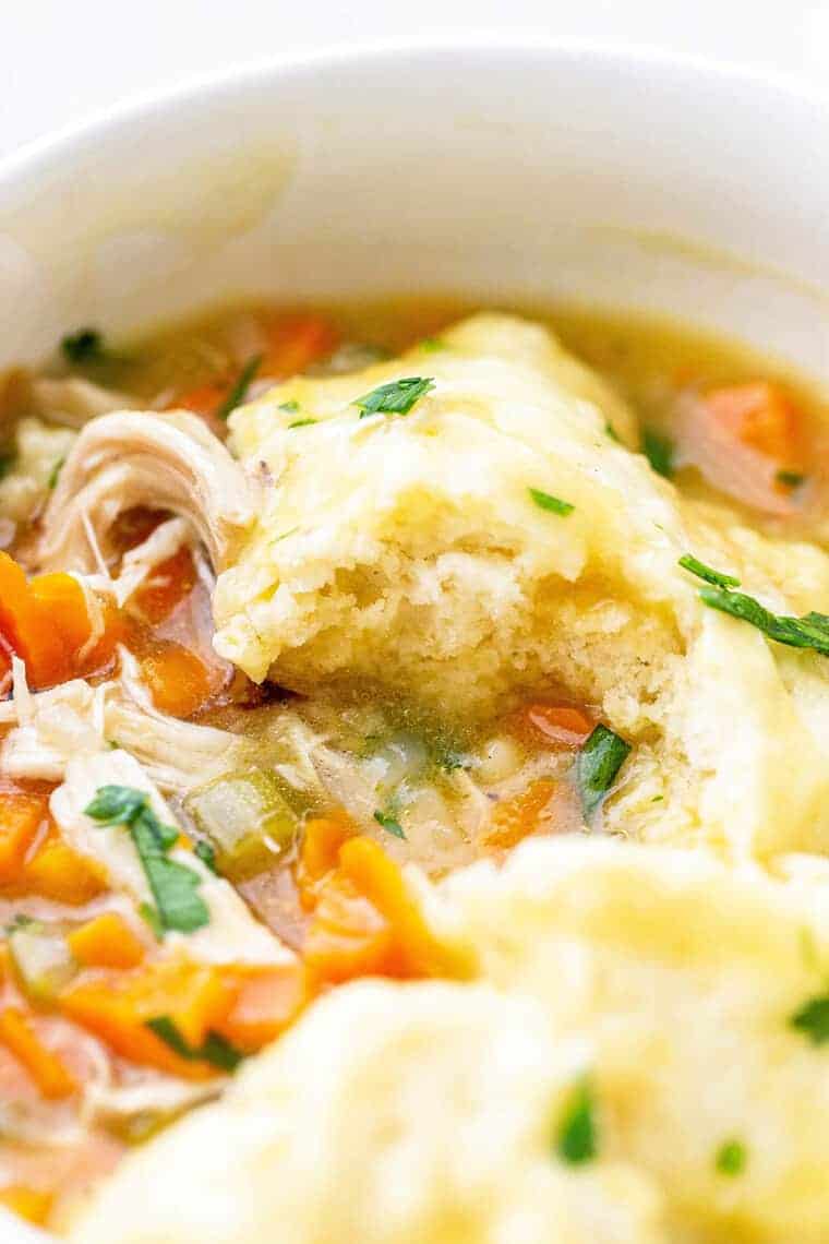 A large pot of homemade chicken and dumplings recipe ready to serve