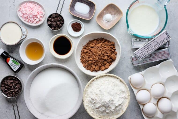 Ingredients to make chocolate peppermint cake on the table before mixing.