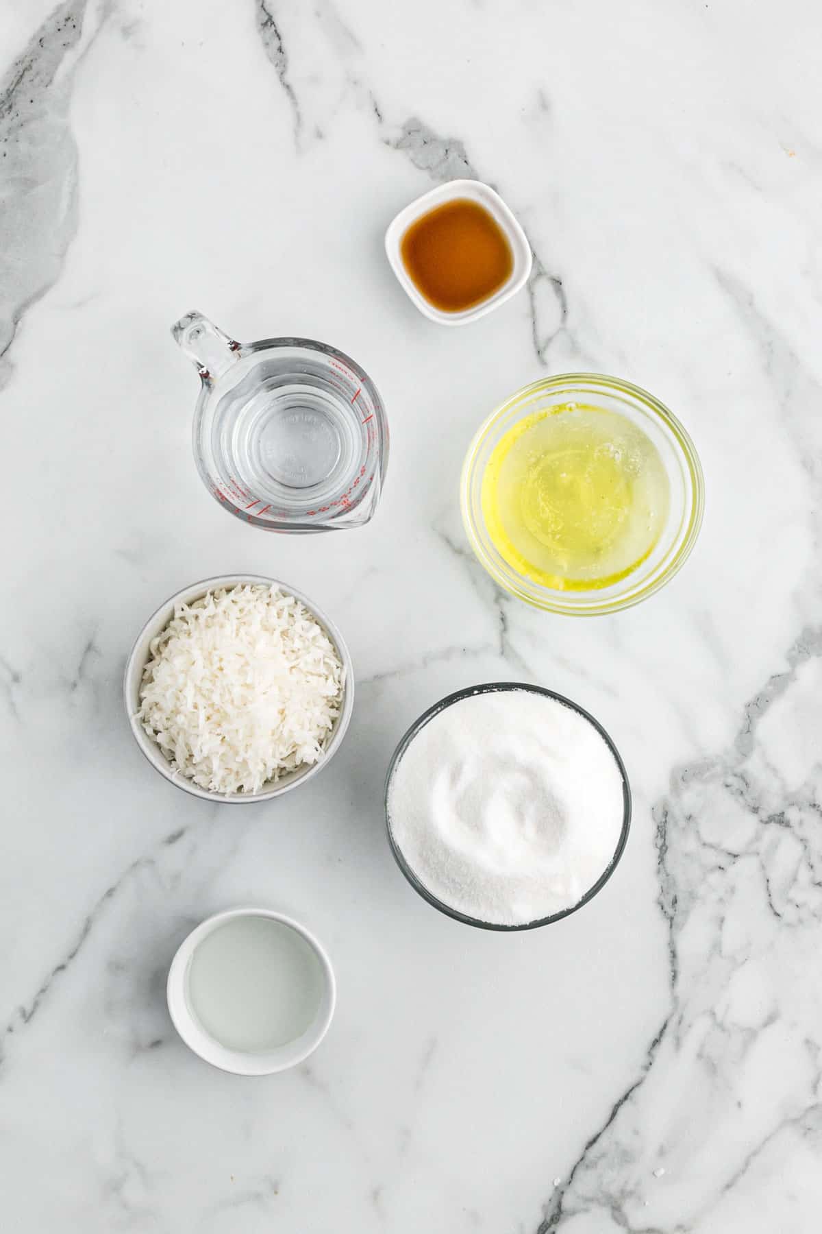 Ingredients to make coconut frosting for the cake on the table.