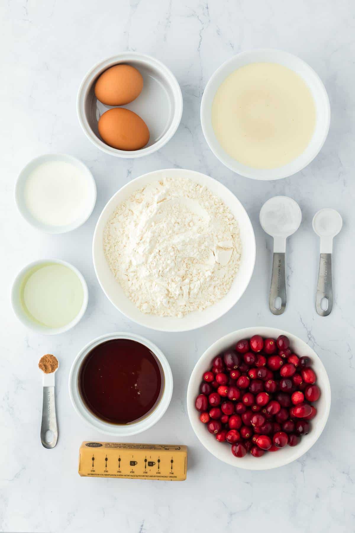 Ingredients to make eggnog pancakes on the table before mixing.