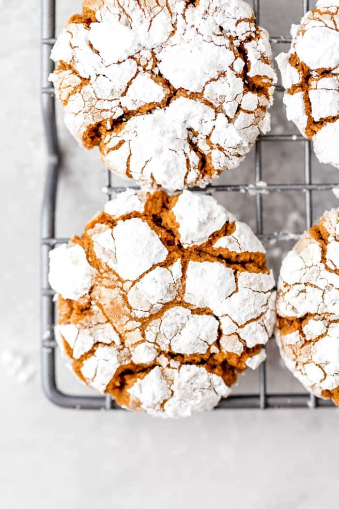 An overhead of ginger crinkle cookies on a wire rack