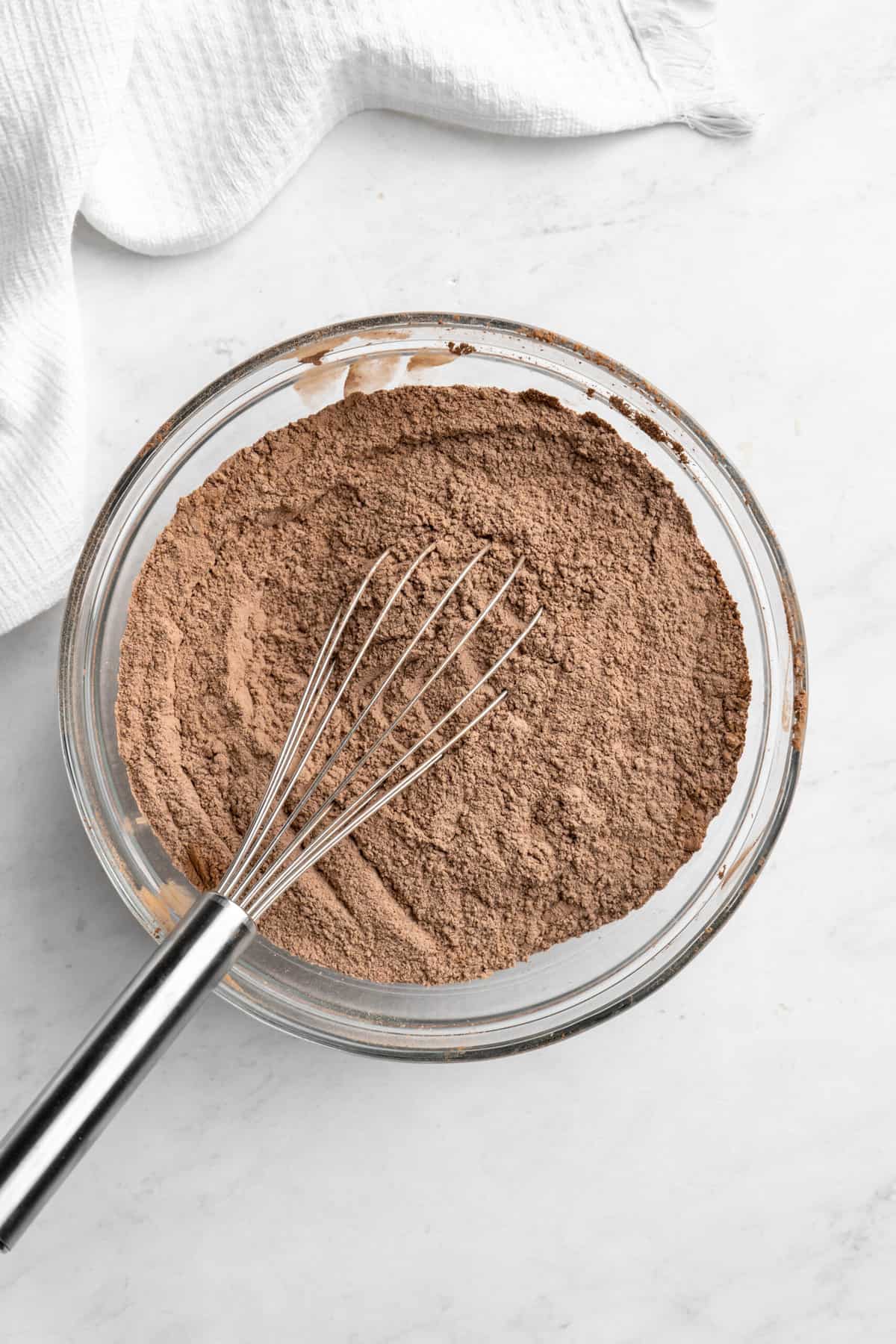 dry ingredients being whisked in a large bowl