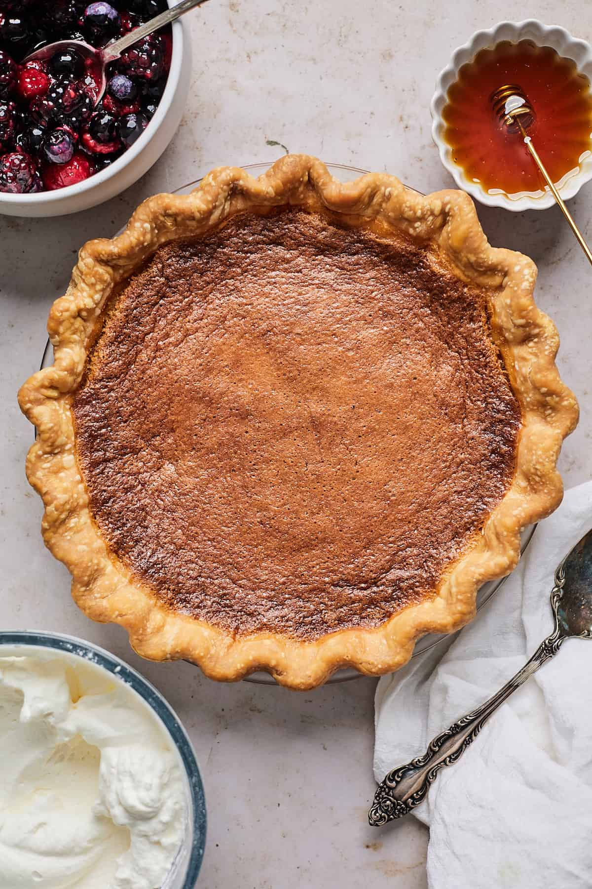 Baked honey cream pie in a pie dish.
