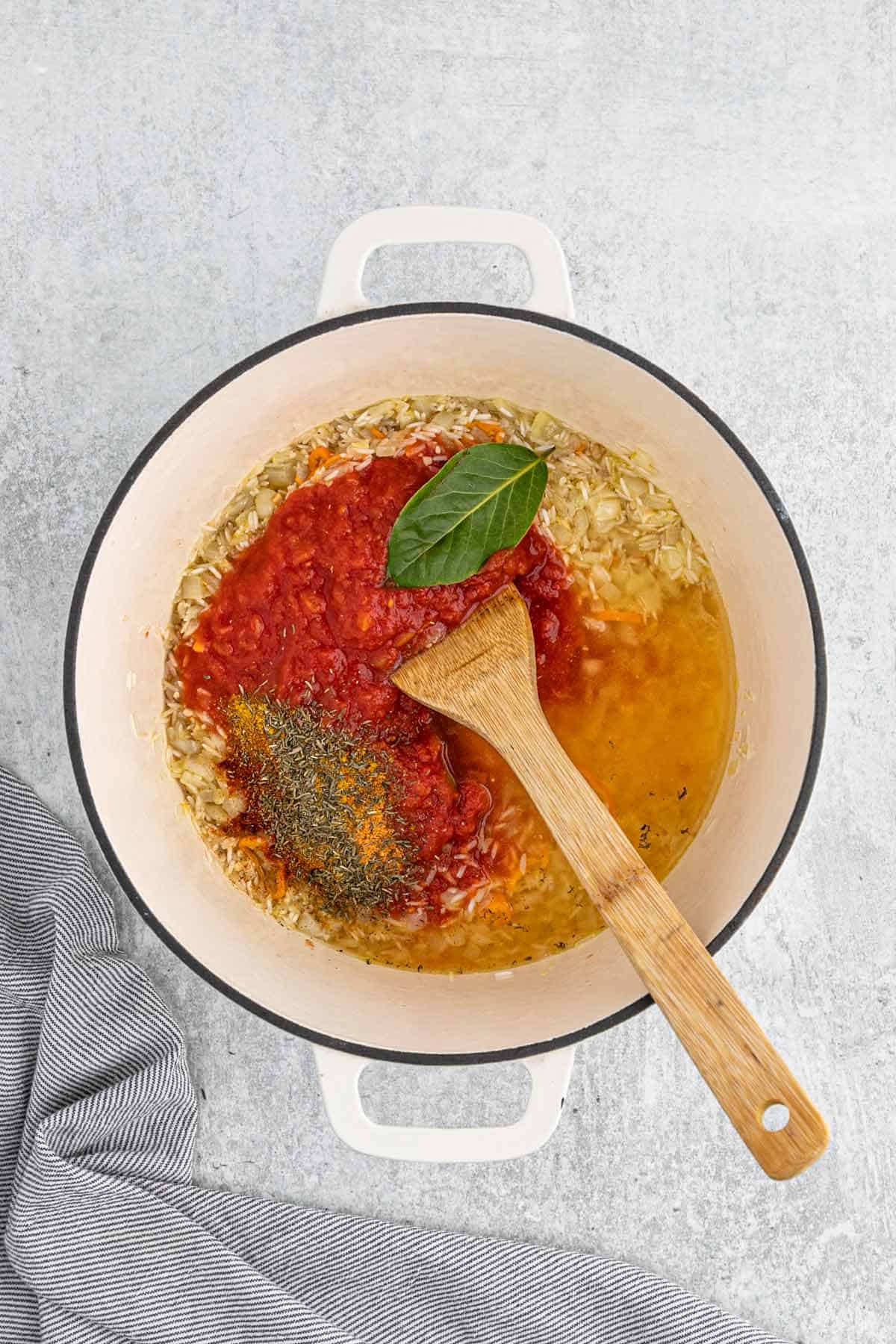 Tomatoes and spices added to the rice.