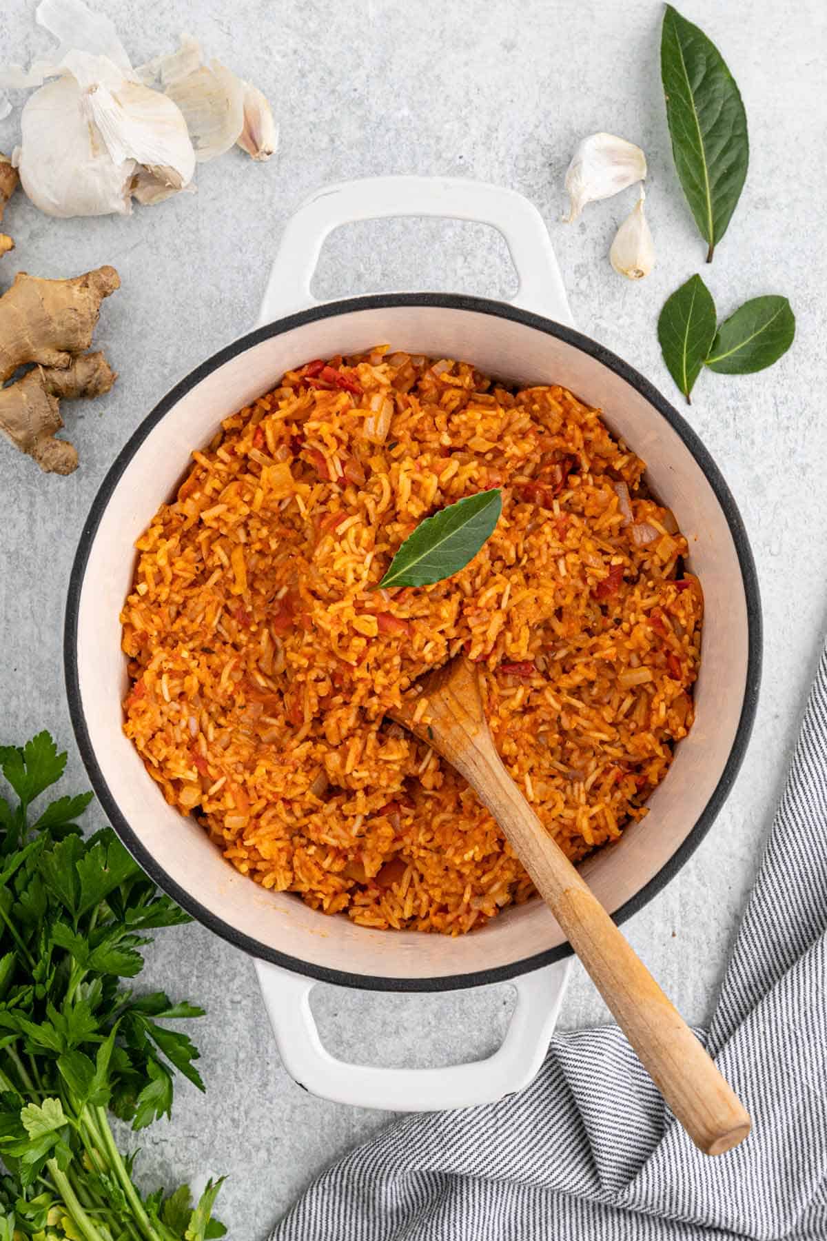 Jollof rice cooked and ready in a large dutch oven.