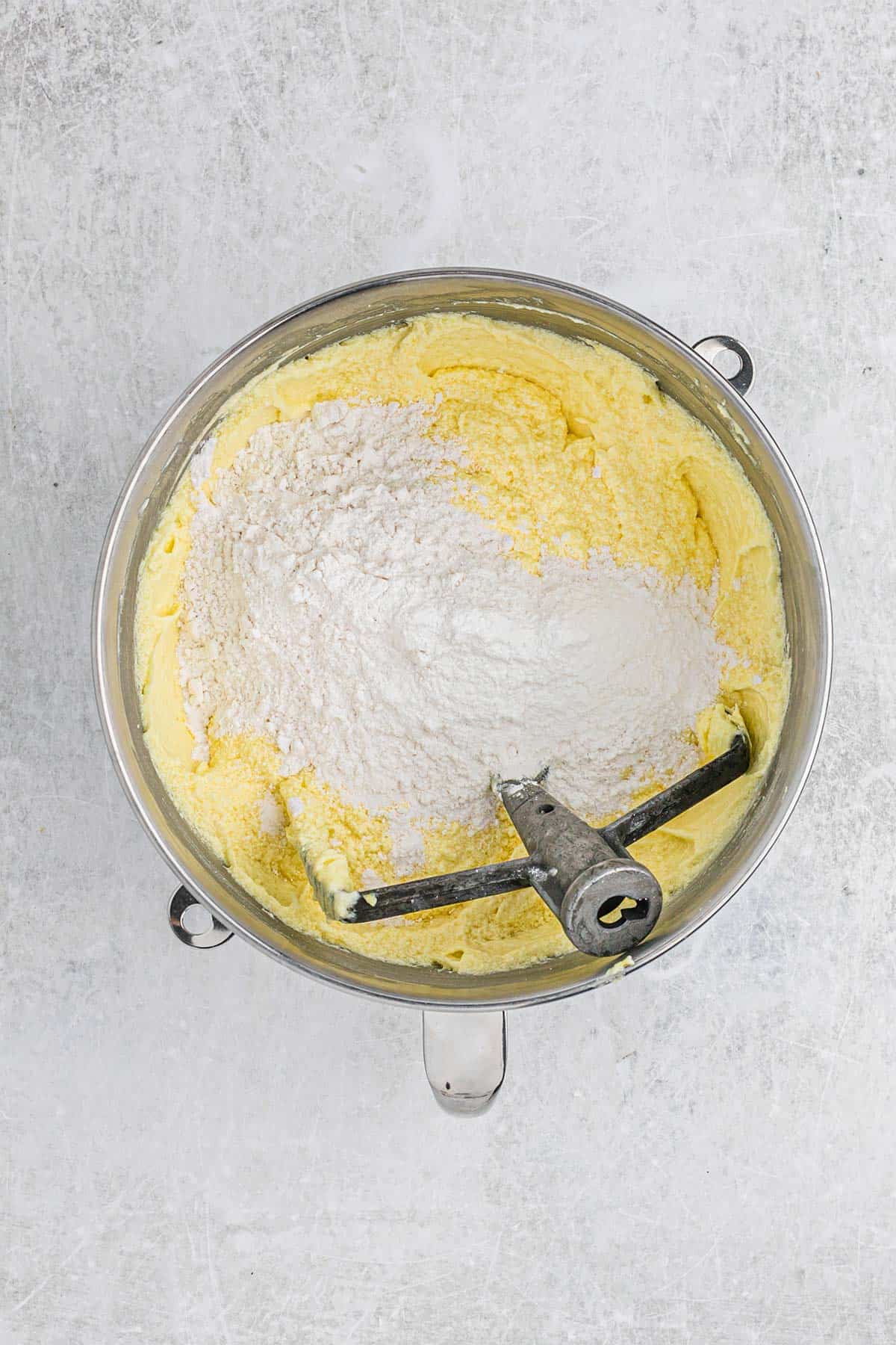 Flour added to the lemon pound cake batter.