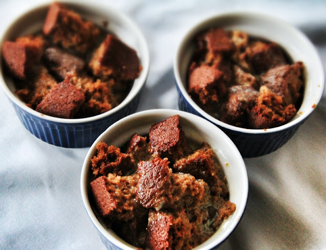 Overhead shot of three bowls full of gingerbread in the process of making this bread pudding recipe.
