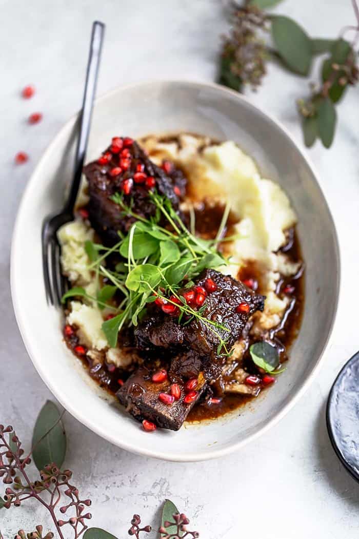 best braised short ribs over mashed potatoes ready to serve for the holidays