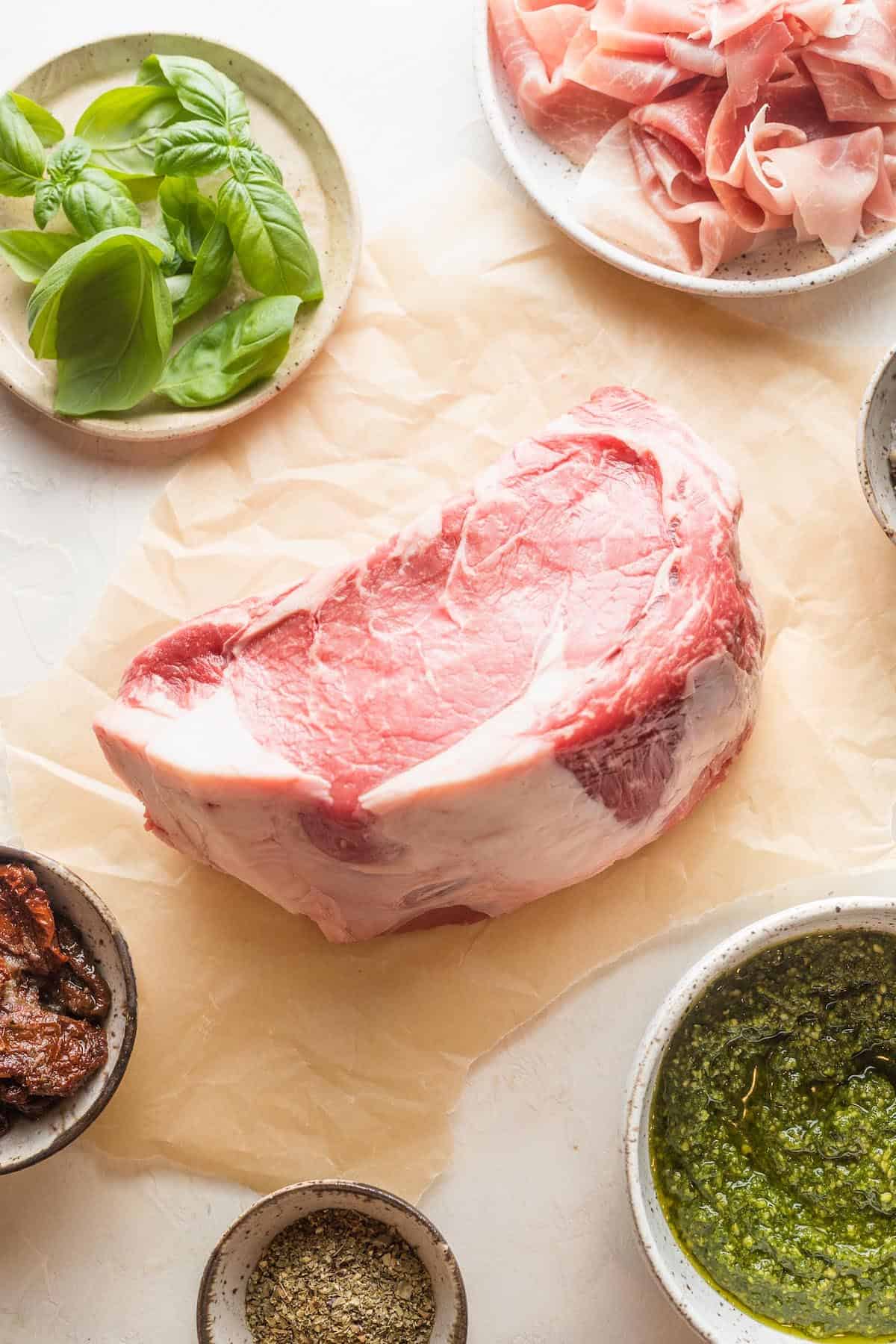 A beef roast on parchment paper.