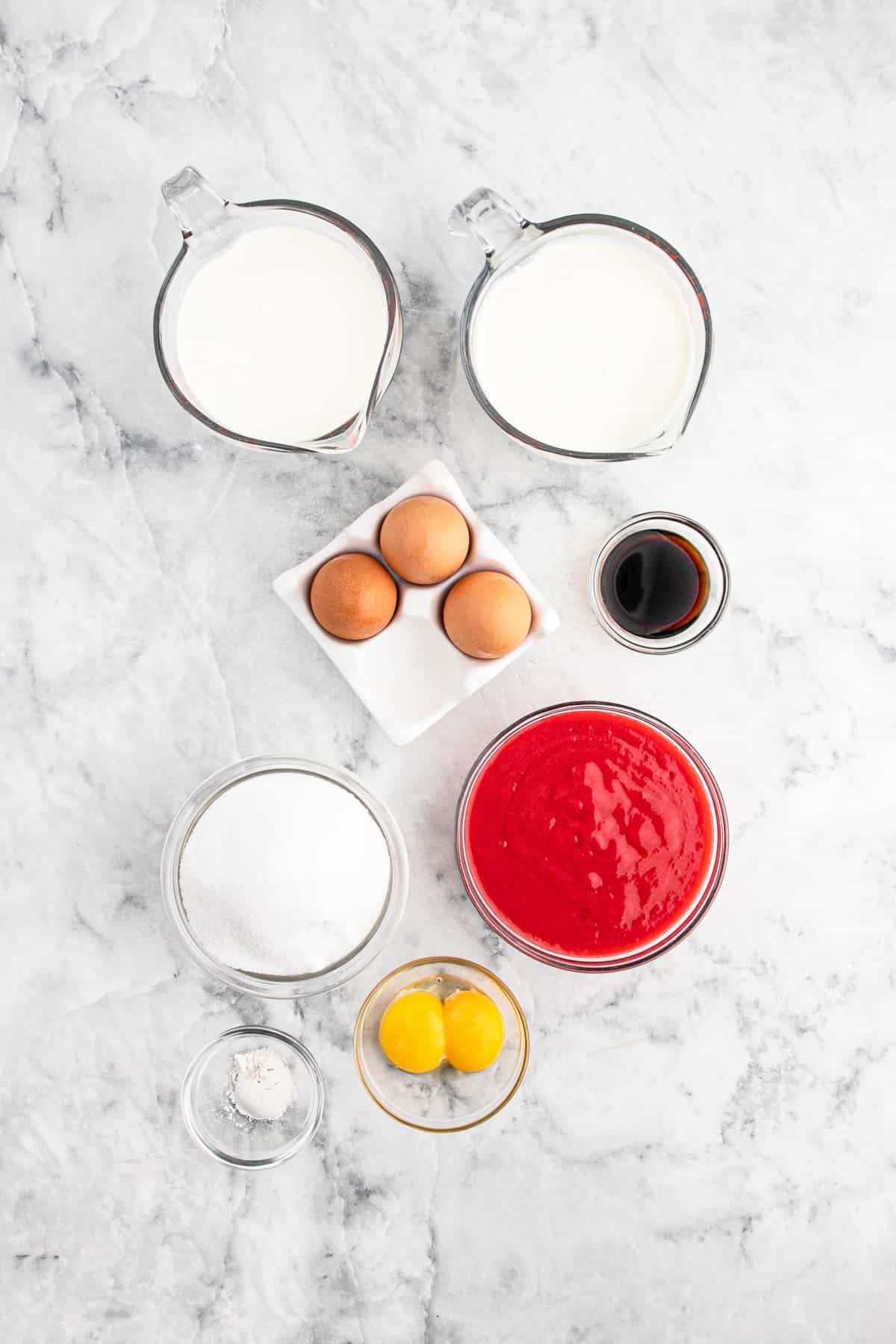 Ingredients to make raspberry ice cream on the table before mixing up.