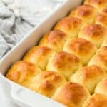 A baking dish filled with perfectly golden yeast rolls